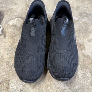 Skechers women’s Black Slip-On Sneakers
